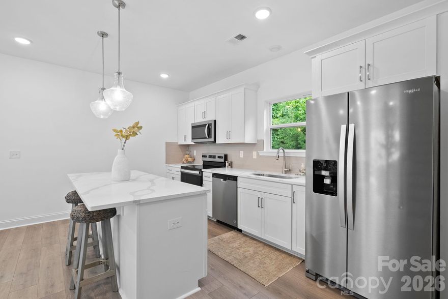 This home features an open concept living area, a dining area and an upgraded kitchen. The kitchen includes white soft close cabinets, stainless steel appliances, white quartz countertops and an upgraded backsplash. On the main level you have access to your garage, plenty of storage as well as a bedroom and full bathroom with private backyard access. The third level features a loft, secondary bedroom and primary bedroom, both with upgraded en suites. The Springs of North Asheville is located just minutes to great restaurants, shops and walking trails. Downtown Weaverville is 5 minutes away and downtown Asheville is only 12 minutes away.