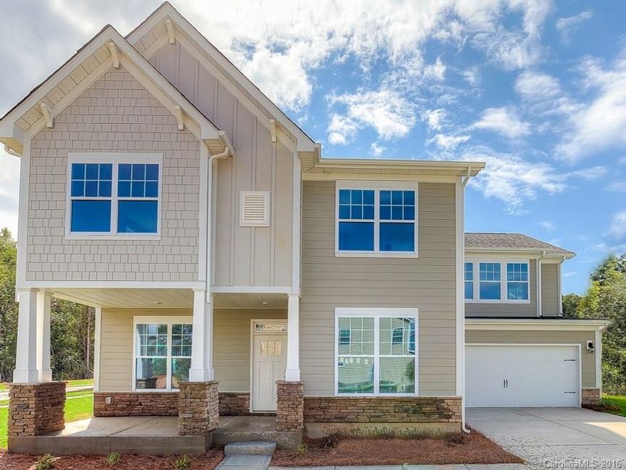 Awesome new plan! It combines the best of two of our most popular plans and is a must-see! The designer kitchen with double ovens and gas range will delight, in addition to the beautiful hardwood floors and upgraded granite on all counter tops. Heavy trim, tile back-splash, too many upgrades to list! This corner lot home is awesome!!!