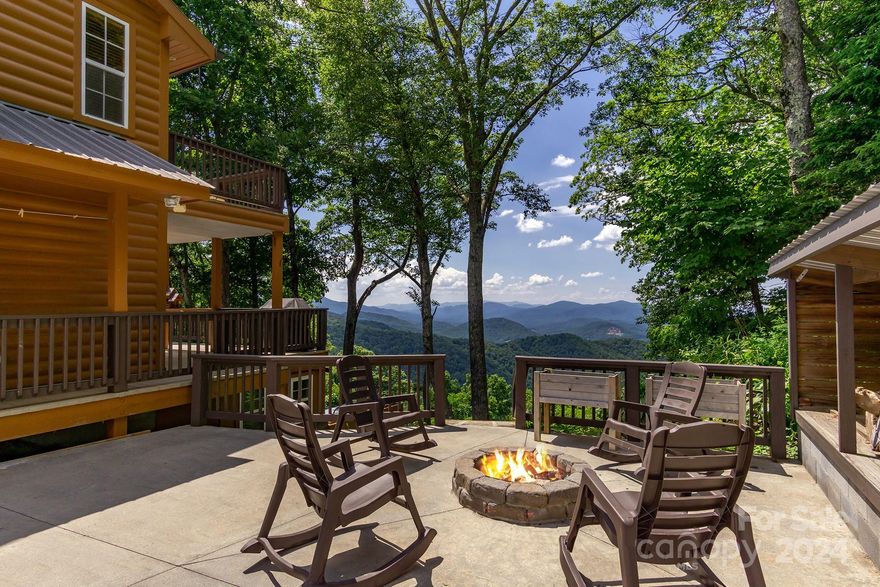 Let's start with the mountain views surrounding this beautiful cabin situated close to the Blue Ridge Parkway, and perfect for an Airbnb investment with five successful years of rental history. This beautiful 3-bedroom, 3-bathroom home offers a warm and inviting escape for both guests and owners alike.
Step inside to find a fully equipped kitchen that flows seamlessly into the dining and living areas, creating an open and spacious environment. The main floor offers a private bedroom and a full bathroom, along with a convenient laundry room. Ascend to the upper level, where you’ll find an expansive primary bedroom complete with large closets and an oversized bathroom that includes a luxurious soaking tub – perfect for relaxation after a day of adventure. The lower level features a cozy third bedroom that sleeps up to 6 guests, separated by a wall for privacy. It also includes a full bathroom and a fun game room, plus convenient access to the large garage. Most furnishings convey.