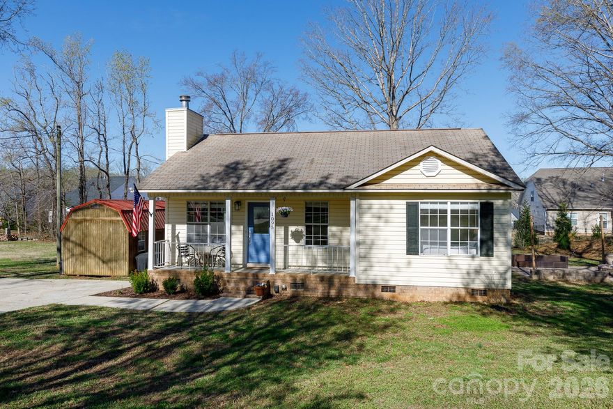 Tucked away in a quiet cul-de-sac, this inviting 3-bedroom, 2-bath ranch offers a serene escape with incredible outdoor amenities. The charm starts at the rocking chair front porch and continues inside, where tons of natural light saturate every room. While the interior provides a comfortable retreat with features like dual closets in the primary suite, the true highlight of this 0.4-acre property is the magnificent backyard. Step out from the deck to your outdoor sanctuary, headlined by a spectacular custom paver patio. This expertly designed space features a built-in stone firepit surrounded by an elegant retaining wall, perfectly set up for unforgettable gatherings under the glowing bistro string lights. The expansive lawn also features a practical storage building. This home is a rare opportunity for those who crave a peaceful, move-in ready retreat with unmatched outdoor living.