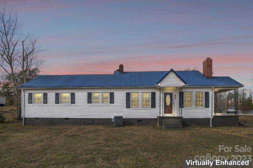 Welcome home to this move in ready ranch home! 3 bedrooms, 1.5 baths. The large, 1.32 acre lot has a beautiful mountain view. There's a large 2 car detached garage, a storage building and outhouse. The detached garage is 24' x 23'. Enjoy sitting by the wood-burning stove in the living room. According to the seller, the low maintenance metal roof is approximately 5 years old.