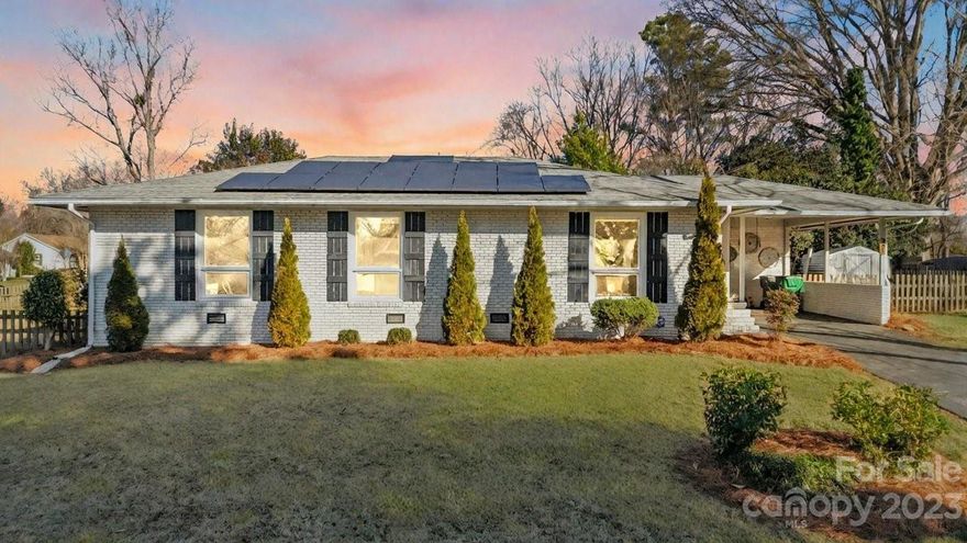 Come see this stunning Madison Park brick ranch! You’ll discover hardwoods throughout as you step into the beautiful open concept living area. Kitchen features gas cooktop, granite countertops, built-in bar/coffee nook with beverage fridge, and stainless steel appliances, including brand new oven/microwave unit. Primary bedroom boasts large closet with barn door along with custom tile shower and double vanity. Two additional bedrooms and additional full hallway bath. Solar panels installed and all windows have been recently replaced, both with warranties that will transfer to the new owner! Seller just had gutters cleaned and fresh pine needle put down. Outdoor covered stone patio, carport, fenced back and side yard, and exterior storage room and shed all make this home a true oasis just minutes from I-77, Southpark and Park Road Shopping Center.