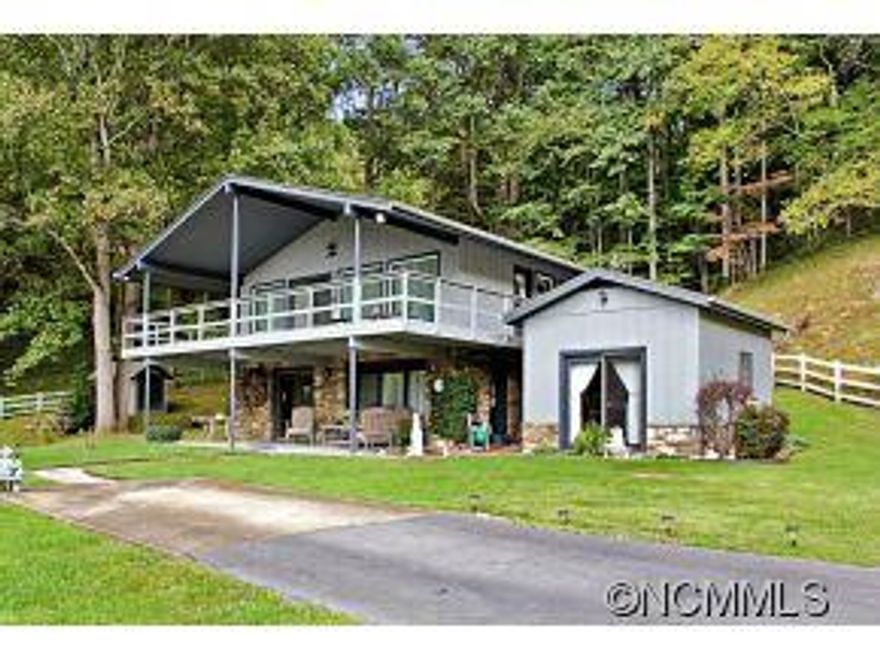 A remarkable private home on 83 acres, offering several lovely building sites, spring branches and good pastures, with a barn and several out buildings.This immaculate home sets at the beginning of the private road with easy paved access less than 10 miles from I-26.Home offers two kitchens, can easily accommodate quests or in-laws. Bring your horses, farm animals and pets and enjoy this tranquil setting!