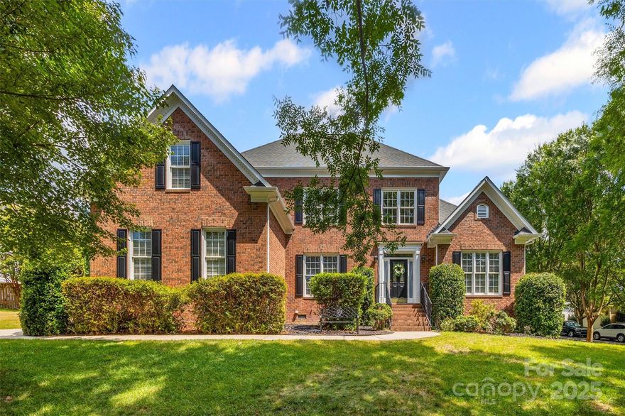 Immaculately maintained home in Lake Shore on the coveted Tega Cay peninsula. A short walk, bike or car ride to Tega Cay Elementary, Trailhead Park + more! This home features an abundance of natural light throughout! Site finished solid oak hardwood floors in the foyer, hallway, kitchen & breakfast area. Open concept living w/a stunning 2 story great room. Dedicated office space on main level. Large kitchen is perfect for gathering w/center island + spacious breakfast area + two-sided fireplace that's shared w/the great room. Primary bedroom on the main level w/tray ceiling & generous walk in closet. Updated primary bathroom features tasteful tile floors, tile shower w/frameless glass, large soaking tub + dual sink vanity w/granite countertop. Upstairs features 3 bedrooms + 2 full baths, w/1 en-suite bed/bath. Bonus room makes a great hobby space. Relax on the back deck & enjoy the private backyard. Room for a pool! 1st floor HVAC replaced in 2024 & 2nd floor in 2021. Welcome home!