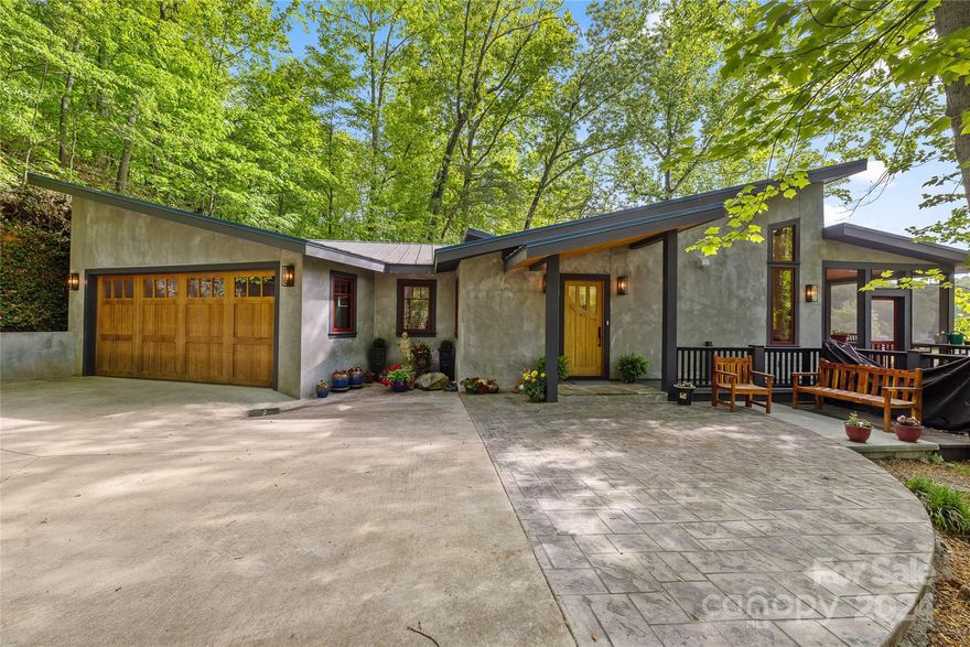 Discover lakeside living at its finest in this charming 3-bedroom, 2.5-bathroom home. "Simply B” boasts over 2,000 sqft of modern living space, the house features a recently constructed open floor plan that emphasizes natural light and scenic views. Wake up to breathtaking mountain vistas across the lake each morning! The home is perfect for hosting guests or multi generational living with a comfortable guest house and a convenient main-level master bedroom. The interior is enhanced by an elevator, ensuring easy access to all levels. Additional practical features include ample parking and a spacious 2-car garage. Step outside to your own private boathouse boasting 900sqft and 2 bedrooms with 1 full bath. The location combines tranquility with accessibility, just moments from local amenities. Perfect for those who value both serenity and convenience, this property invites you to embrace a peaceful lifestyle. Experience it all at this exceptional lake-shore home! And "Simply B"