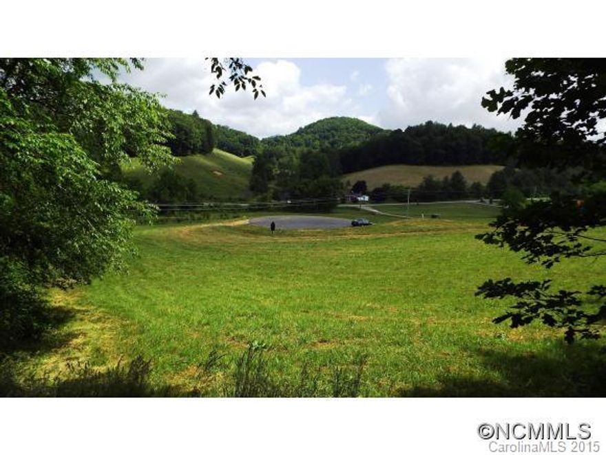 At an elevation of approx. 2,300 feet, this homesite sits at the end of a cul de sac and offers both a sunshine meadow and shady woods. It has a gentle slope - perfect for most any style home.  Great place for a vegetable garden as you enjoy pastoral and ridge view around. Mountain Traditions boasts nature trails, clubhouse, ponds, picnic areas and overlooks. Only 20 minutes from Asheville, just outside Mars Hill - home to Mars Hill University.