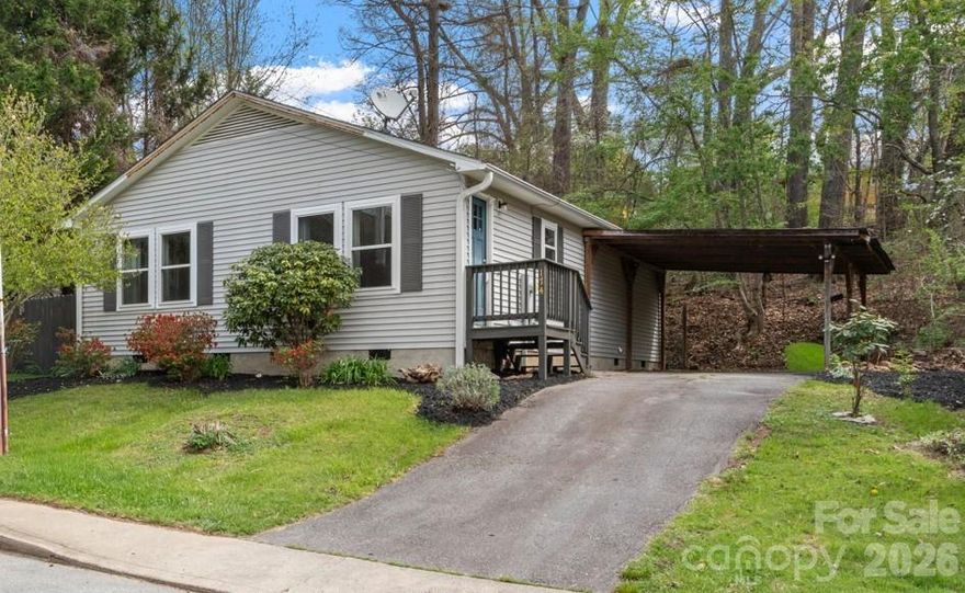 Tucked into the heart of sought-after 28806, this charming home offers the perfect blend of comfort, convenience, and Asheville lifestyle. Enjoy relaxing or entertaining on the spacious deck overlooking a fully fenced yard, ideal for  play, or gardening. Covered off-street parking adds everyday ease, while the location puts you just minutes from everything that makes Asheville special, local dining, shopping, breweries, and outdoor adventures. Whether you're looking for your next home or a smart investment, this one checks all the boxes for easy, in-town living.
