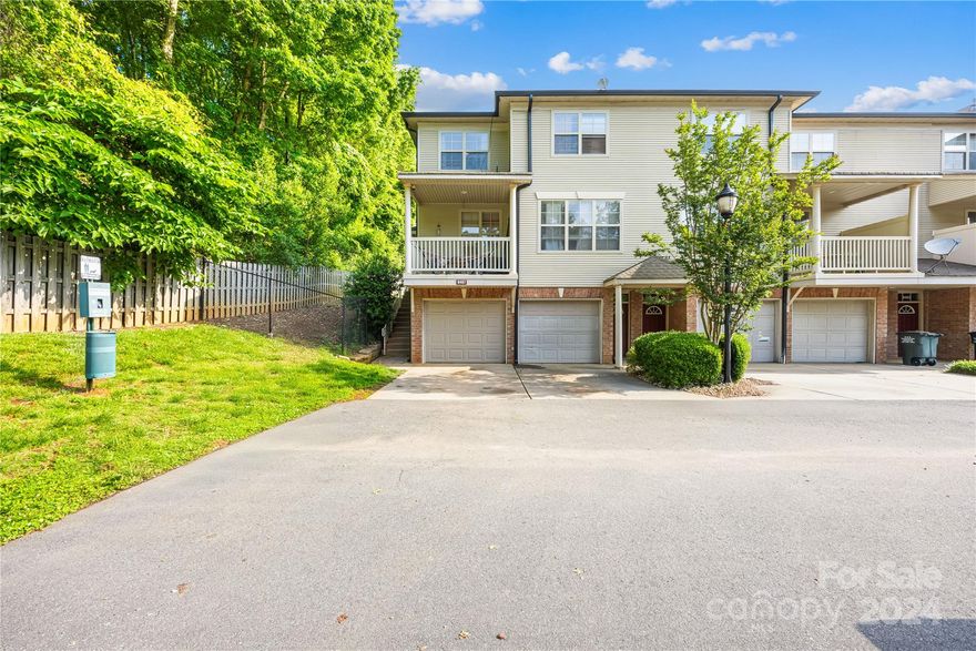 Discover modern living in this 3 bedroom, 1.5 bath end unit condo in Charlotte with a balcony! This quaint condo home has an open floor plan, perfect for entertaining or simply unwinding in style. Step onto the second-floor balcony & immerse yourself in the serene views of the neighborhood, creating a tranquil retreat right at home. With natural light flowing through the home, each corner of this residence feels inviting. The large laundry room is on the lower level & offers ample storage space for all your needs. Lower level room may be used as a 3rd BR. Recent updates include: 2021 AC. 2021 SS Stove, Fridge, & Dishwasher. 2022 Ceiling fans, garage door, kitchen & bathroom faucets. 2024 Laminate floors on main level and stairs. Replaced blinds in the home in 2019 and 2022.  New light fixture in 2nd floor bathroom. Conveniently located near the University area of Charlotte, I-85, and Uptown Charlotte, this residence offers the ideal blend of urban convenience and suburban tranquility.