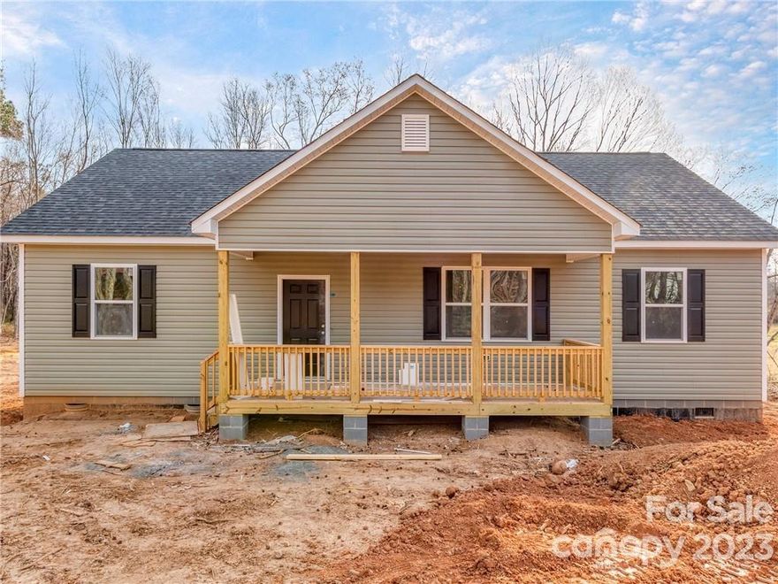 Well thought out space that lives much larger than it's size - Huge covered front porch - Home opens to the main living space with tons of windows for great natural light - Open kitchen with white shaker cabinets, granite countertops/backsplash, Stainless Steel appliances & island- Large living room & separate Dining area- LVP flooring throughout home (no carpet)- Split bedroom plan- Owner's suite w/oversize walk in closet- Owner's bath w/tiled walk in shower & dual basin vanity - Generous secondary bedrooms & closets - Hallway bath w/white shaker cabinets & granite countertops - Large Laundry/Utility room with walk in pantry, coat closet, built ins & extra storage- Large covered back deck overlooks your level, private half acre lot– 6 panel doors- Cased windows- Upgraded hardware & fixtures- You will not find these finishes on a new home at this price point- Crawl space for storage- Estimated home completion date end of December - Call anytime for more details