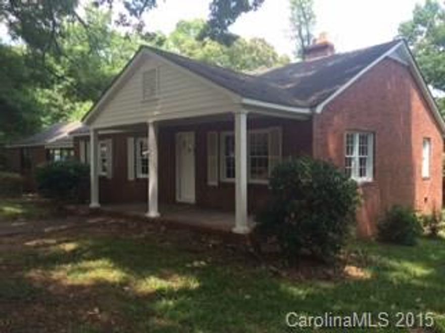 Charming brick ranch home on beautiful lot. This home has a lot of its original charm. Hardwood flooring throughout most of home. 3 bedrooms with 1.5 baths. There is an extra den that could be used as a 4th bedroom,office or play room. Sunroom or sitting area off of kitchen opens to deck. Spacious rooms. Great storage. Enjoy the charm of this move in ready home. Oversized carport with tons of parking. Covered patio and rocking chair front porch. Walking distance to park.