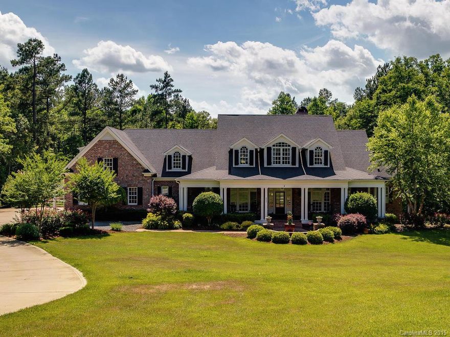 Outstanding Executive home in Lake Wylie. Brazilian cherry hardwood floors, coffered, trey, vaulted ceilings, Custom lighting and millwork throughout. 10 ft ceilings, Gourmet Kitchen w/premium appliances, island, bar, breakfast nook. Glorious master on main, in-ground pool,  1100sf pool house, 3300+sf of covered outdoor living space w/FP, professional landscaping, game room, media room w/bar, game room, secondary BR's have private baths and WIC. All this on 4+acres. Clover schools. Low SC taxes