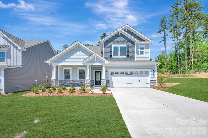 Welcome to the Trafford! Walking in from the front covered porch you are greeted with an inviting foyer with a main level guest bedroom and full shared bathroom. The home opens up to your kitchen, breakfast area and family room. The kitchen is equipped with stainless steel appliances, gas cooktop, exhaust hood and an island 
for extra prepping space. The family room is spacious and inviting and is completed with a gas fireplace for those colder nights. You'll notice throughout the main living spaces is easily maintainable EVP flooring and 5" crown molding. Through the atrium door is a patio, perfect for entertaining or just enjoying a morning coffee. Upstairs the EVP flooring extends into the hallway to simplify cleaning. There are two additional bedrooms, both with walk-in closets, a shared bathroom and the laundry room with cabinets. Walking in through the double doors you'll find the owner's bedroom. With plenty of natural lighting, a tray ceiling and 5" crown molding, you may find it difficult to wake up in the morning. The ensuite is fit for a spa, with a tiled deck garden tub, separate tiled shower, dual vanity and private toilet area, there is plenty of space for everyone to get ready. Finally, the walk-in closet provides enough space for any size wardrobe. Welcome to your new home!