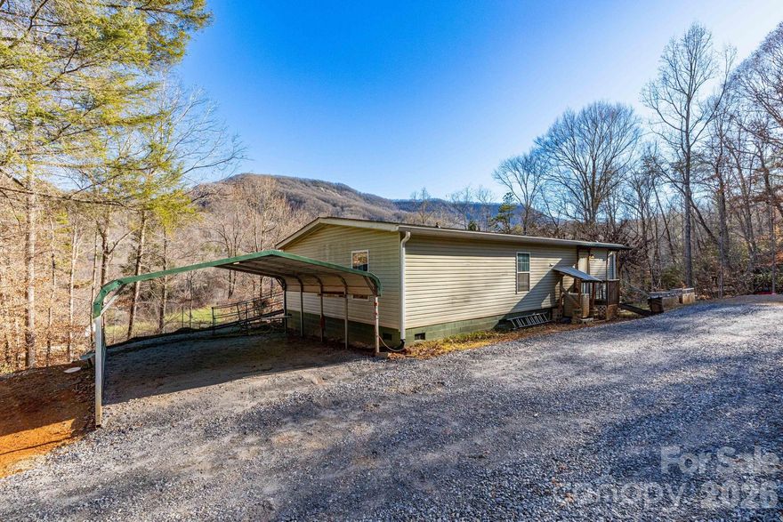 Just Listed! Manufactured Doublewide 3 beds, 2 full baths, and a gorgeous mountain view in the privacy of Old Fort. New roof, retaining wall, and structural support installed 2025. Per seller there was no damage to the home after Helene, these updates were recommended for future protection so seller followed through. Come see this view for yourself! Great opportunity to live somewhere beautiful and serene without breaking the bank.