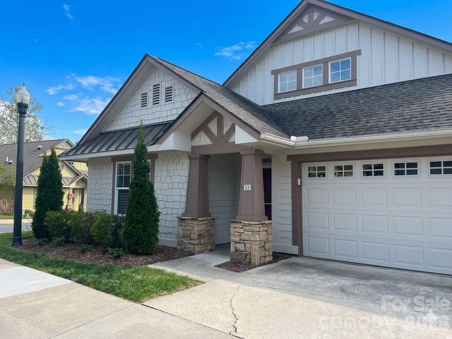 PRICE IMPROVEMENT!!!COMMUNITY-WIDE OPEN HOUSE 4/18 12:00-4:00.  Please stop by the clubhouse first for information on participating properties.  This lovely, one level, move-in ready cottage located in the beautiful gated community of Wolfpen is a must see!  The kitchen, with custom cabinetry and granite countertops, is open to the dining and great room areas with vaulted ceilings and perfect for entertaining guests or family gatherings.  The split bedroom plan includes a spacious primary bedroom with en-suite bath and an abundance of closet space. Just off the primary bedroom, you'll find a bonus room full of natural light perfect for a sitting room, office or craft room. From the bonus room, you can step out onto a private stone patio where you can enjoy your morning coffee or sip on an afternoon tea.  Updates include a newer roof, hvac, lighting and Anderson storm doors (see update sheet attached).  You'll find additional storage space in the drop down stair attic in the attached two car garage.  Wolfpen offers every amenity imaginable including a clubhouse, fitness room, heated lap pool, tennis/pickleball courts, putting green, walking trail and pond.  The diverse monthly and annual social calendars include activities to please every enthusiast.  The location of this immaculately maintained community is unmatched.  Less than 10 minutes to the best of food, shopping and medical care in downtown Hendersonville.  Only 30 minutes to downtown Asheville and Brevard.