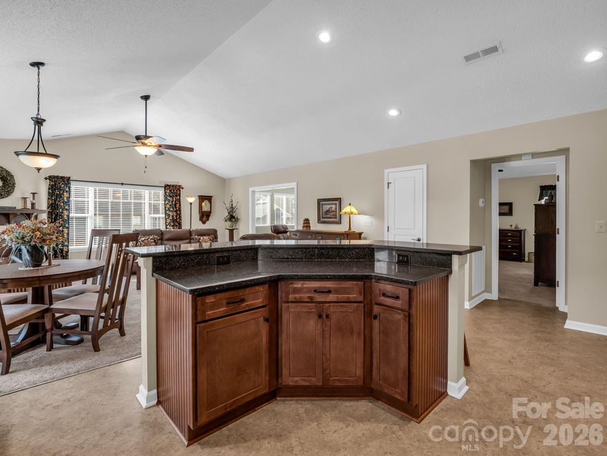 PRICE IMPROVEMENT!!!COMMUNITY-WIDE OPEN HOUSE 4/18 12:00-4:00.  Please stop by the clubhouse first for information on participating properties.  This lovely, one level, move-in ready cottage located in the beautiful gated community of Wolfpen is a must see!  The kitchen, with custom cabinetry and granite countertops, is open to the dining and great room areas with vaulted ceilings and perfect for entertaining guests or family gatherings.  The split bedroom plan includes a spacious primary bedroom with en-suite bath and an abundance of closet space. Just off the primary bedroom, you'll find a bonus room full of natural light perfect for a sitting room, office or craft room. From the bonus room, you can step out onto a private stone patio where you can enjoy your morning coffee or sip on an afternoon tea.  Updates include a newer roof, hvac, lighting and Anderson storm doors (see update sheet attached).  You'll find additional storage space in the drop down stair attic in the attached two car garage.  Wolfpen offers every amenity imaginable including a clubhouse, fitness room, heated lap pool, tennis/pickleball courts, putting green, walking trail and pond.  The diverse monthly and annual social calendars include activities to please every enthusiast.  The location of this immaculately maintained community is unmatched.  Less than 10 minutes to the best of food, shopping and medical care in downtown Hendersonville.  Only 30 minutes to downtown Asheville and Brevard.