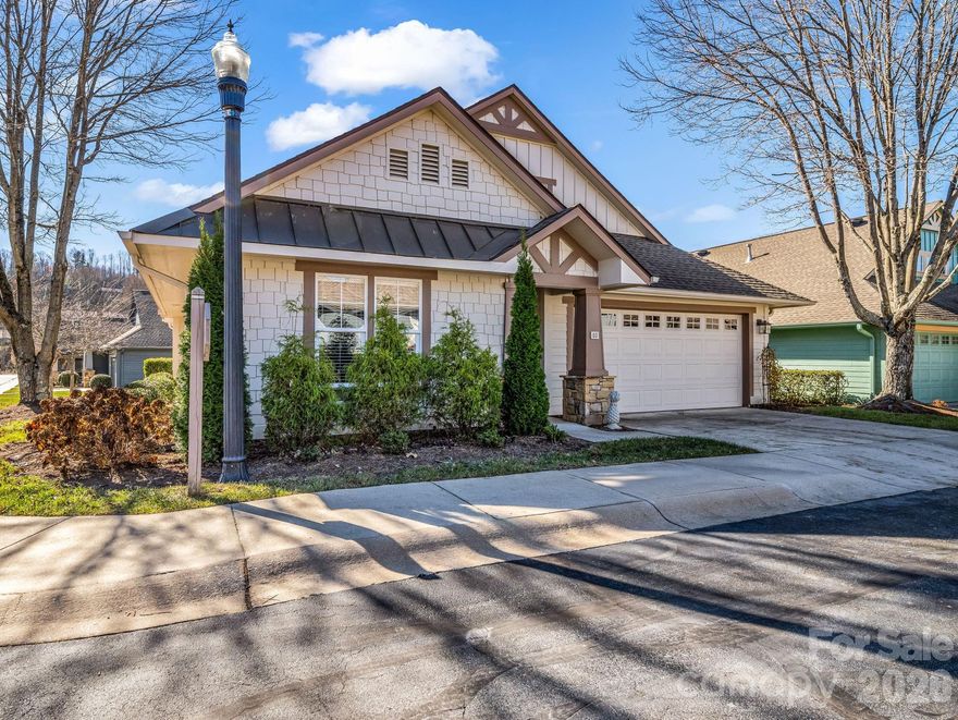 PRICE IMPROVEMENT!!!  This lovely, one level, move-in ready cottage located in the beautiful gated community of Wolfpen is a must see!  The kitchen, with custom cabinetry and granite countertops, is open to the dining and great room areas and perfect for entertaining guests or family gatherings.  The split bedroom plan includes a spacious primary bedroom with en-suite bath and an abundance of closet space. Just off the primary bedroom, you'll find a bonus room full of natural light perfect for a sitting room, office or craft room. From the bonus room, you can step out onto a private stone patio where you can enjoy your morning coffee or sip on an afternoon tea.  Updates include a newer roof, hvac, lighting and Anderson storm doors (see update sheet attached).  You'll find additional storage space in the drop down stair attic in the attached two car garage.  Wolfpen offers every amenity imaginable including a clubhouse, fitness room, heated lap pool, tennis/pickleball courts, putting green, walking trail and pond.  The diverse monthly and annual social calendars include activities to please every enthusiast.  The location of this immaculately maintained community is unmatched.  Less than 10 minutes to the best of food, shopping and medical care in downtown Hendersonville.  Only 30 minutes to downtown Asheville and Brevard.