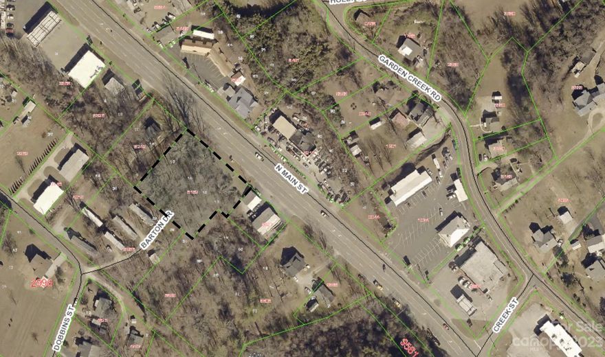 Price reduction! Motivated Seller! Priced to SELL! Now Below Tax Value! Check out this one acre lot located on the North side of Marion Street has lots of potential. The lot has 200 feet of road frontage and is surrounded by successful local businesses such as restaurants, gas stations, and fast food chain restaurants. This property is zoned R-2, Neighborhood Residential.  If cleared with the city, the property may be suitable for townhouse or condos. If rezoned and graded, this property could be suitable for a restaurant, gas station, or free standing building.  Property also has access to city water, city sewer, and natural gas. You cannot beat the location of this property!  Seller is offering seller financing.  Seller would consider selling this parcel and the house beside this lot all together.  Call today for more information.