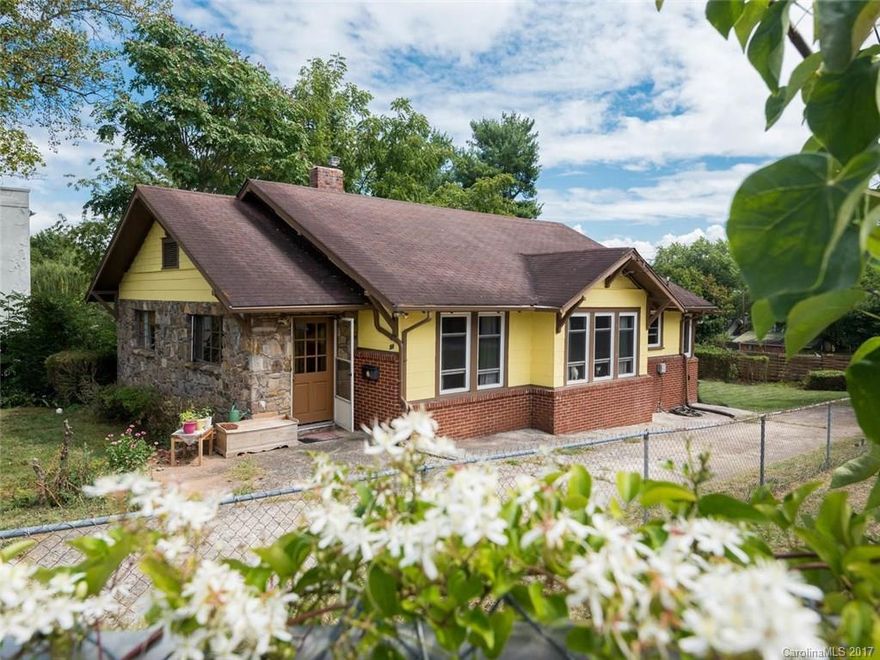Move in ready classic stone and brick West Asheville bungalow with abundant windows and natural light make this home perfect for those wanting to be close to it all. Minutes from downtown, the heart of WAVL, Malvern Hills pool and Hominy Creek Park with its access to the French Broad Greenway this home offers an updated kitchen, baths and a large partially fenced back yard. Basement and out building offer ample storage, the rock study could be used as 3rd bedroom. The only thing missing is you.