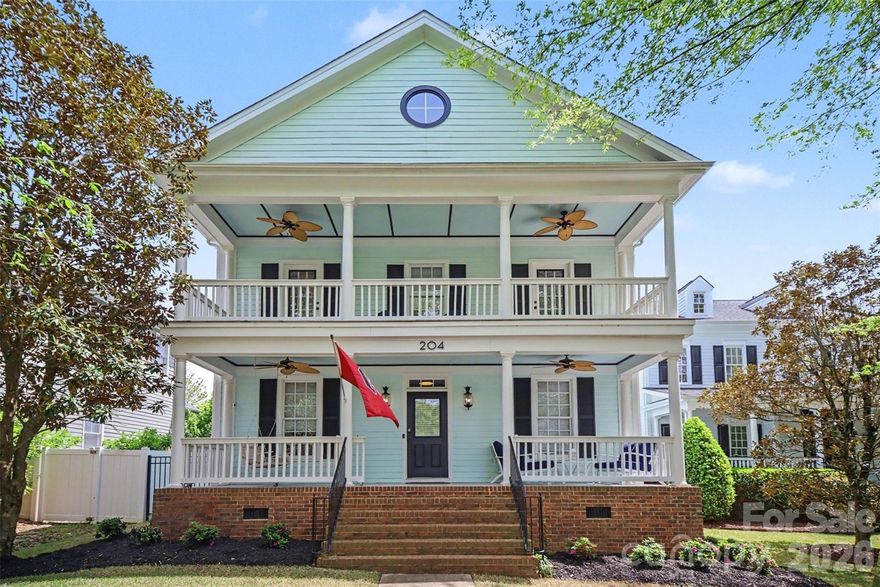 Discover the quintessential Baxter Village lifestyle at 204 Mills Lane, a stunning two-story residence that masterfully blends classic Southern charm with modern luxury. This home welcomes you with its iconic double front porches, offering a rare and private vantage point over one of Fort Mill’s most vibrant, walkable communities. The interior features a thoughtfully designed floor plan characterized by site-built quality and refined updates, including fresh interior paint and brand-new flooring throughout the first floor. Other upgrades include Ecobee smart wi-fi thermostats, Carrera marble countertops in bathrooms, Rachio smart irrigation system, Schlage Encode exterior door locks and tankless water heater. The gourmet kitchen has been thoughtfully updated with plenty of cabinet and counter space for cooking and entertaining. For those working from home, the main level includes a dedicated office space with French doors, while the family room provides a cozy retreat anchored by a gas fireplace. The upper-level primary suite is a private retreat featuring a full bath and walk-in organization. Secondary bedrooms are large with ample closet space. Enjoy the outdoors from either the main or upper covered porches or on the oversized freshly painted rear deck. The oversized garage easily accommodates 2 cars and plenty of toys. Baxter is zoned for the highly sought-after Fort Mill School District, including Orchard Park Elementary, Pleasant Knoll Middle, and Fort Mill High. This property is strategically positioned on a level lot in a quiet sector of the village, offering a secluded feel while remaining just steps from high-end amenities including one of the pools being a short walk away. Residents enjoy access to elite community features, including two pools, tennis courts, four playgrounds, and over 12 miles of wooded hiking trails. Convenient to shopping and dining iwith Baxter Town Center and Kingsley located just minutes away. Easy access to I-77 and Highway 160, making downtown Fort Mill and Uptown Charlotte easily reachable.