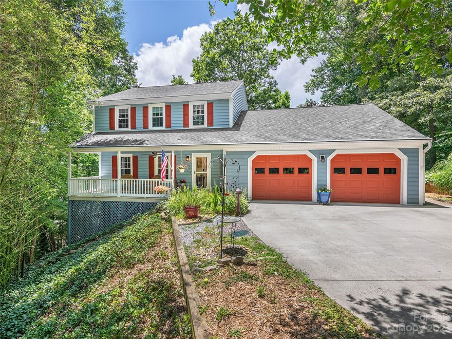 MULTIPLE OFFERS RECEIVED. PLEASE PRESENT YOUR BEST OFFER BY 7 PM ON SUNDAY JUNE 18.

Nestled on a private wooded lot with long-range MOUNTAIN VIEWS from late Fall to Spring, near the Hunters Trace clubhouse and pool, sits a wonderfully spacious updated home on two levels with additional space to expand in the unfinished basement. Two primary bedroom suites - one on the main level and one upstairs - plus two additional guestrooms. The main level primary would also make a great den. Furnace and central AC new in 2018. Natural gas fireplace and hot water heater. Roomy kitchen with island. The basement has an additional fridge and double oven perfect for entertaining. Reverse osmosis filtration system. Fabulous outdoor living spaces to enjoy the surroundings and views include a covered front porch, open-air deck and patio, and spacious covered and screened porch off the kitchen/dining area overlooking the fenced back yard.  Minutes to shopping, schools, Biltmore Park and more.