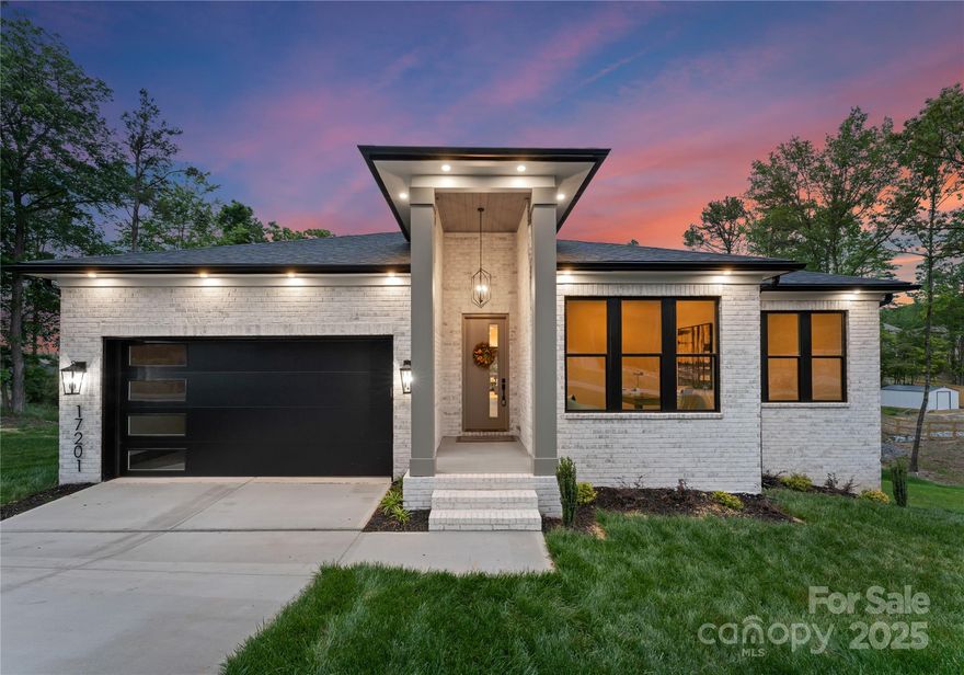 Welcome to the Signature Series by Northway Homes—where timeless style meets modern comfort. Located near Lake Wylie, and near the desirable Palisades neighborhood, this home offers a perfect blend of convenience and tranquility. With the area experiencing exciting growth, it's an ideal time to buy. This property features a spacious yard, perfect for outdoor living, with no HOA restrictions. The brick, 3-bedroom, 2-bathroom design highlights exceptional craftsmanship and attention to detail. Inside, an open layout flows seamlessly throughout the living spaces, with a beautiful kitchen featuring tile backsplash and high-end appliances. The 10-foot ceilings elevate the sense of openness, and the primary suite provides a private retreat with a luxurious ensuite bath. Sliding double glass doors open to invite effortless indoor-outdoor living, making this home a true gem.