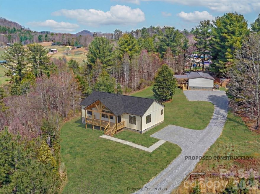New construction with huge mountain views. Enjoy the 9-foot ceilings in this open floor plan. This to-be-built Champion Ironclad 2860 offers modern mountain living on a private 1-acre lot in Leicester. Designed with an open layout, large windows, and a spacious covered front porch, the home blends style, comfort, and functionality. Sip your morning coffee on the porch while taking in the long-range Blue Ridge Mountain views, or unwind in the peaceful surroundings after a long day. Built by Champion Homes, it features energy-efficient appliances, contemporary finishes, and a structural warranty—all just a short drive from downtown Asheville. Perfect as a primary home, retreat, or investment.