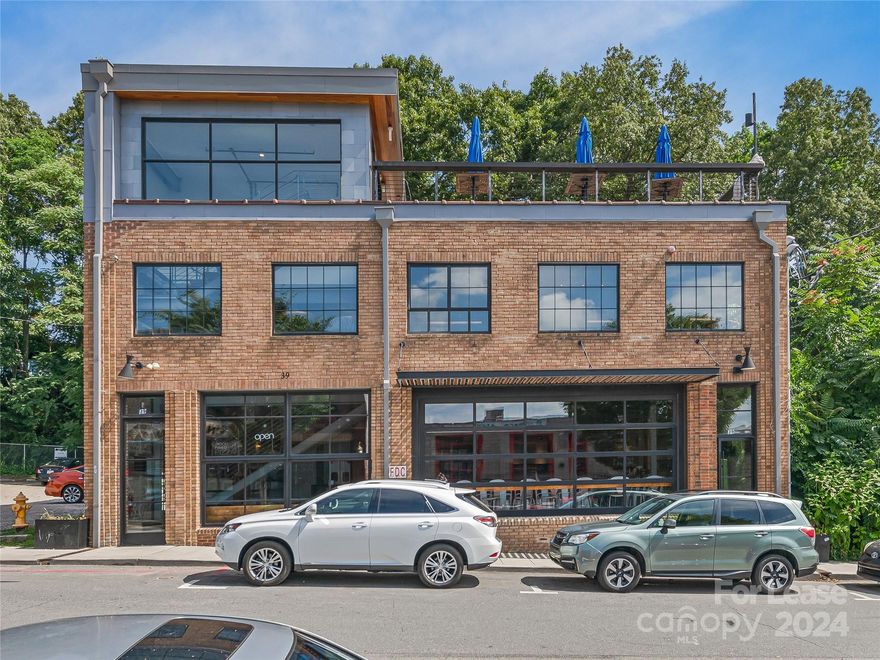 Exceptional opportunity to lease a turnkey commercial building in the vibrant South Slope District of Downtown Asheville! Located directly across the street from James Beard Award winning Chai Pani and moments walk to Green Man Brewery, this 5,159 SF turnkey property comes with all current equipment and inventory included. Located in a bustling area known for its lively atmosphere and thriving brewing and culinary scene, the property boasts 48 feet of prime road frontage, ample street parking, and a stunning 2,250 rooftop patio with a full bar. Dumbwaiter installed for efficient food and beverage transportation between floors. Walkable to Biltmore Avenue and the sites and sounds of Downtown Asheville. Easy access to I-26 and 240. Please contact Listing Broker for showing requests.
