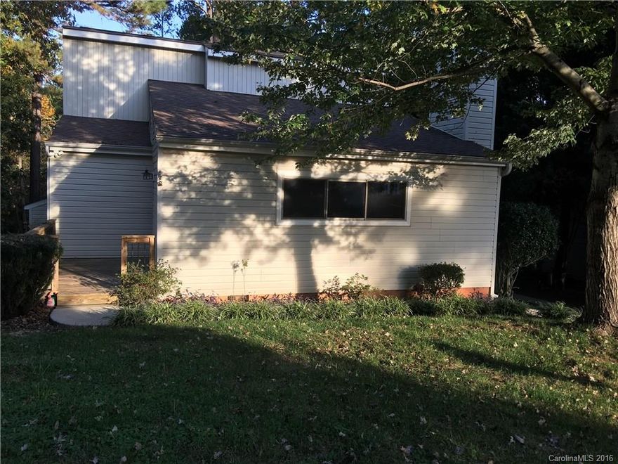 This cute cottage/bungalow is a must see for this price and look thru the woods and you can partially see the lake.  Owner's Suite is a great size on the upper level!  Perfect price and perfect location with schools, etc and located in Tega Cay.  This will not last long!