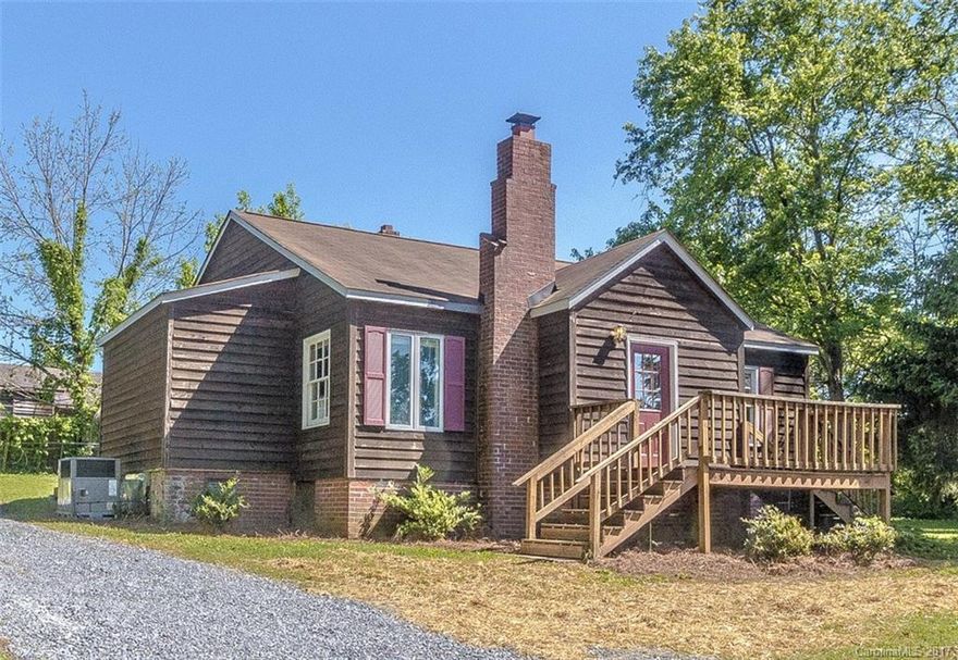 Convenient Cramerton location! Must see this super cute home! It's updated and spacious with a large bright kitchen.  French doors lead from the dining room to the living room where you will find a vaulted ceiling, wood flooring, and beautiful rock fireplace. Home has two large bedrooms and two full baths.  Back yard is large and level. What more could one want?