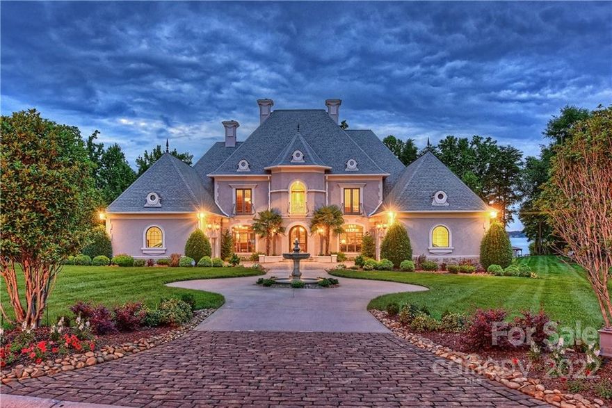 Elegant European style waterfront estate in exclusive gated community.  Features include library with built ins & copper tin ceiling, Chef's kitchen, screened porch, billiard/game room, media room, & surround sound throughout. Outdoor entertainers paradise including heated pool/spa with expansive deck, covered patio with several outdoor dining spaces, private sandy beach with built in fire pit, and private pier with boat lift.  Wine cellar with barreled ceiling and tasting room on lower level.