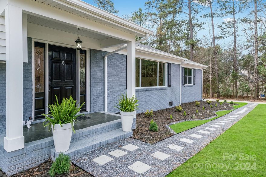 Welcome to the illustrious Rock Hill Country Club Golf Community! This beautifully remodeled 4 Bed, 3 Bath Split- Level is located on the BACK 9 featuring a Private Community Lake- a fisherman's delight! The open foyer & living/dining area boasts tons of natural light & recessed lighting throughout. The spacious Eat-In-Kitchen is complete with Upper/Lower Cabinetry, built-In pantry, SS Dual Farm Sink, SS Appliances, & Full-Length Center Island w/ pot sink filler & ample seating. The main floor features rear-yard access & Two-Car Atch'd Garage. The main & upper floors incl. Southern Gray Laminate Floors. The upper floor hosts three generously sized bdrms & main hall bath. The Bright Primary Suite incl. a walk-in-closet, en-suite bath w/marble-tiled floors, dual vanity, LED mirror, & over-sized, stand-in shower w/ rain shower head. The lower floor incl. a laundry rm, Full Bed/Bath, Family Room w/ natural stone marble tiled wood burning/gas FP & Three-Season sunroom w/ rear-entry access.