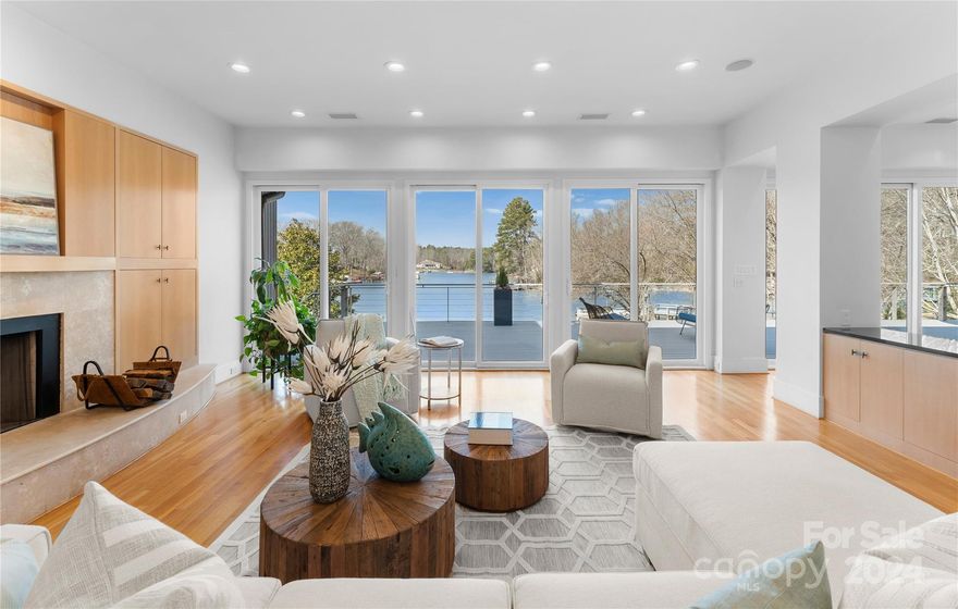 This absolutely stunning modern home on a tranquil cove in Lake Wylie will make you say WOW as it takes advantage of the amazing water views out of nearly every window! Lake living at its finest, it also has a newly refurbished swimming pool. The open floor plan is inviting and cozy while offering spectacular views. A chef's kitchen has all the tools you need to whip up a feast, including an AGA stove, which once you use, you will never want to cook with anything else. The primary en suite on main has a lovely terrace overlooking the pool and lake and a large walk-in closet. Even work feels like a vacation as both office spaces overlook the water. An elevator takes you to the spacious basement which is perfect for entertaining with its large living room with fireplace, a wine room, media room, rec room and bar area for hosting outdoors. Right next to the gym is a sauna.  3 bedrooms and 3 baths complete the lower level. Upstairs has bedrooms, a dedicated office and plenty of storage.