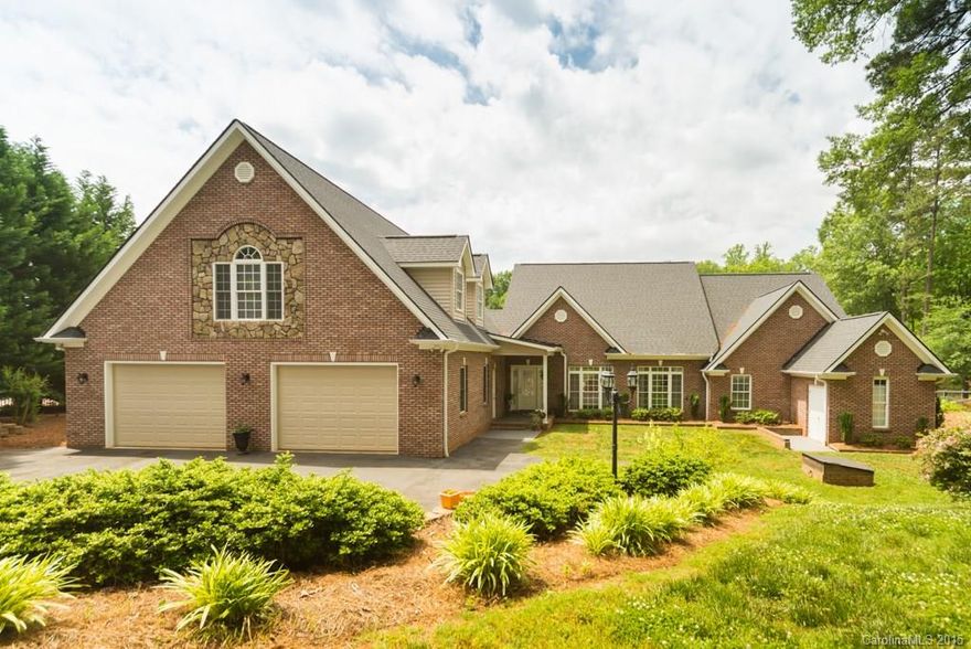 Lake Wylie waterfront home w/heated, in-ground salt water pool, boathouse, floating dock. Gorgeous hardwoods, tile. Open office overlooking pool and lake. Custom Marsh kitchen with island and large bar area. Main floor master with fireplace opens to deck. Master Bath has whirlpool tub, separate shower, double sinks. Main floor bonus room with full bath & walk-in closet has wheelchair accessible doors. 2BR, large bonus on second floor. 2-car garage w/unfinished room. Clover schools. Low SC taxes.