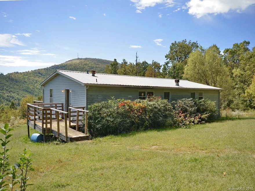 Year round paradise or summer retreat.  Sit on the porch and enjoy the spectacular view.  Gas fireplace for making  cool weather most enjoyable at  your mountain top home.  New well pump on the original well.    Home in good condition.  Organic garden located to the left of home.     Motivated seller.