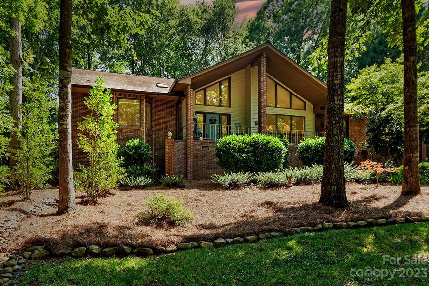 19 Tanglewood Road offers spacious ONE-LEVEL living within the gates of Lake Wylie's River Hills. This custom residence has generous entertaining areas w/vaulted ceilings & walls of windows. There's a roomy foyer, which opens to the formal dining w/built-ins & living with a see-through fireplace to the family room. It opens to the kitchen w/updated cabinetry, granite countertops, & stainless appliances including gas range & separate wall oven. While cooking, overlook the breakfast room w/views to the park-like yard. There are 3 good-sized bedrooms, including the primary suite w/its own sunroom, plus a luxurious bath w/soaking tub & large shower. Relax on the front porch, the back deck or the brick paver patio accessed from the living, family, breakfast & sunroom. There's laundry w/desk area, plus a 3-car garage with attic storage. This amenity-filled lakefront neighborhood has 24 hour security, a country club, a marina, walking trails, parks for vacation living every day. Welcome home!