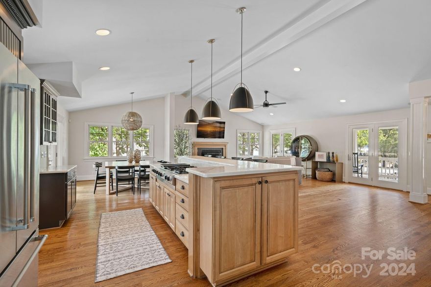 Opportunity to own a true lake house in one of Cornelius’s most coveted neighborhoods, Patrick's Purchase! No HOA, no restrictions...this property offers unlimited potential whether you are looking for a cozy lake cottage, a renovation opportunity, or tear down and build your dream home. Situated on approx. 190' of pristine shoreline, this unique parcel boasts breathtaking panoramic views from three sides of the property. Nestled on a private, cul-de-sac street, the home is the perfect blend of modern luxury and rustic charm. Step inside and enjoy the open, spacious layout designed to maximize natural light and showcase the picturesque views from every angle. The stylish kitchen offers professional appliances and a center island that invites you to gather and entertain. The front and rear outdoor terraces create the perfect spot for morning coffee or evening relaxation. Just a short distance from The Peninsula Golf Club, shopping, dining, & entertainment. Plenty of room for a POOL!