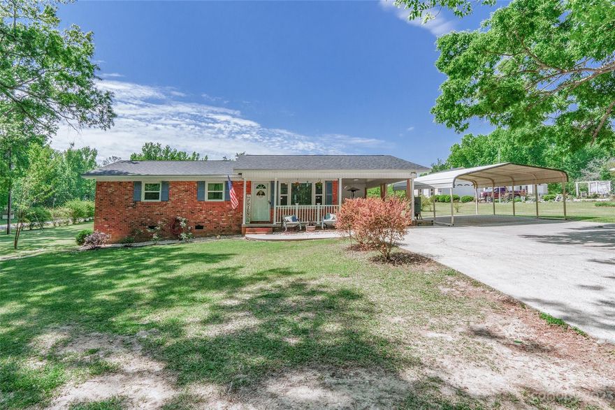 Only a few minutes from downtown Waxhaw! Charming brick ranch home with an open floor plan. Very well maintained, and pride of ownership shows!  Beautiful kitchen is well lit with recessed lighting and offers stainless appliances with work island. Dining area is spacious to accommodate large gatherings.  Backyard lot is huge, includes a large shed for storage, above ground pool installed in 2020!  Buford Schools!  **Washer and dryer will convey. Security cameras will not convey. Septic pumped recently.