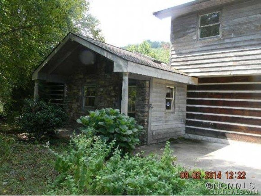 Log home with huge master bedroom. Included is 2.65 acres behind house which is nice pasture land with separate PIN.Subject has a shared septic agreement and shared water meter with Asheville city water.Home has large den and large back porch. Deck off master bedroom.Multiple offers, seller asking for Highest and Best by 5:00 Monday the  offer is binding until signed by both parties.