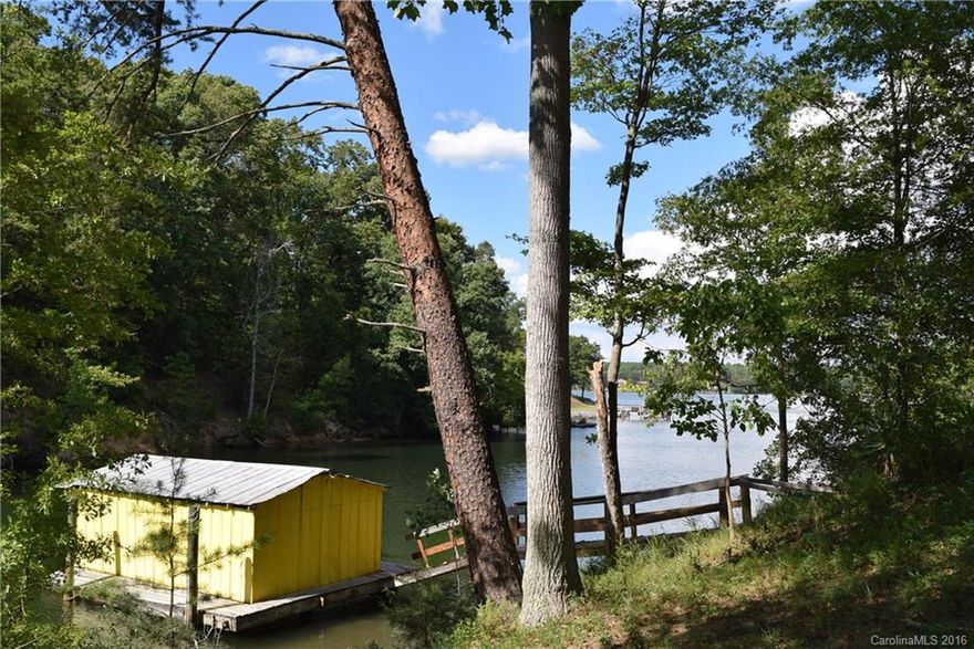 What an excellent opportunity on Lake Wylie! Choice 1 acr lot with over 350' shoreline & gorgeous hardwood trees, nestled among fine custom waterfront homes in excellent Clover school distr. Property located on a short cove, perfect for swimming and paddling around, with quick access to open water for boating and water sports. Boathouse with floating dock, plus mobile home currently on property to enjoy until you're ready to build.  Great location, great value! Also listed as land MLS #3207431