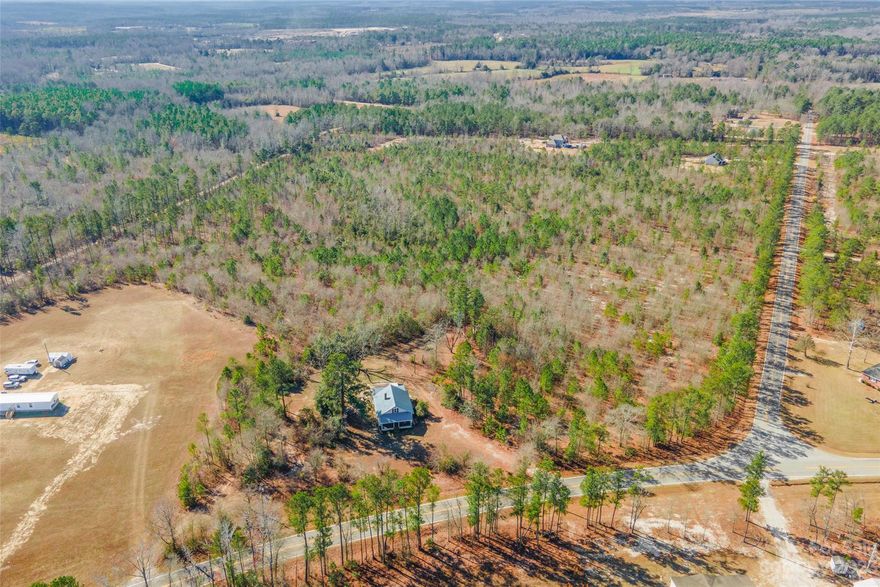 3 bedroom, 1 bath home nestled on over 5 acres of scenic beauty. The home boasts recent upgrades, including new windows installed in 2023, a newer septic system, a brand-new panel box, and updated electrical wiring. Hardwood floors grace the entirety of this space. With partial plumbing updates already in place, this home presents a canvas for your creativity. Embrace the expansive surroundings and envision the possibilities that over 5 acres of land offers. This home, is being sold as-is and is poised to continue as a promising project for any savvy investor!