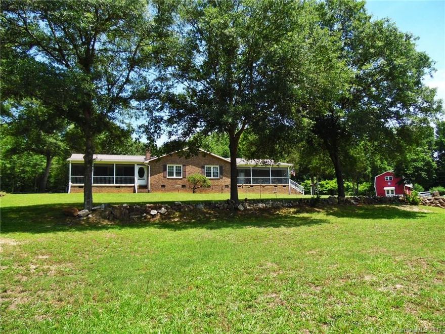 Escape city life & retreat to this beautiful 3 BR/2 BA brick ranch located on 7 picture-perfect acres w/2-story barn/workshop w/1300 sq ft, fencing, RV parking & detached garage w/472 sq ft studio apartment! Main house features formal dining, spacious family room with stone fireplace, huge master suite & multiple screened porches for enjoying the quiet country surroundings in all seasons. A rare find, this unique property offers the best of nature & the simpler life – and it could all be yours…