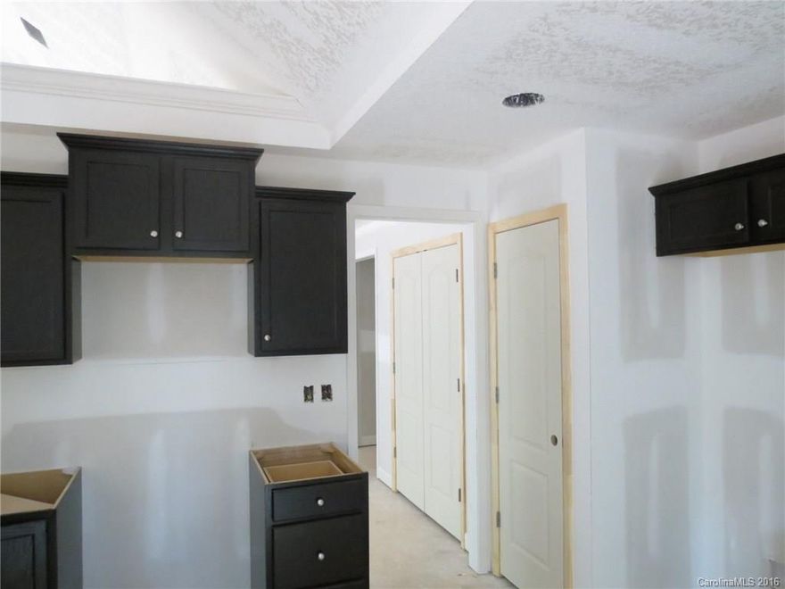 Great new construction in Clover School District on 1.5 acres of land.  Home will have hardwoods throughout with vinyl in the kitchen and bathrooms.  Kitchen and bathrooms will have granite counter tops.  Back of the home has a covered screen porch and a very private back yard.  This property has no HOA and is outside the city limits.