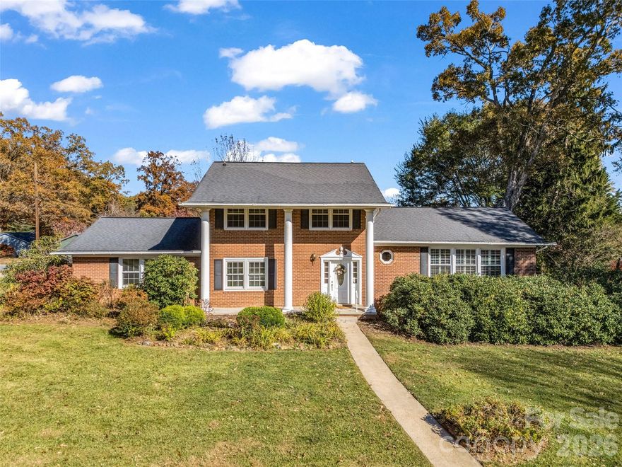 Welcome home to desirable Bent Creek-where comfort, community & nature come together! This inviting home perfectly balances style, warmth & easy access to Asheville’s vibrant outdoor life. Nestled between city conveniences & Pisgah National Forest, walk or bike right from your door into miles of scenic trails. Spend your days hiking, biking or fishing at nearby Lake Powhatan, NC Arboretum, Blue Ridge Pkwy & French Broad River. Offering potential for STR use, this home sits on a flat corner lot surrounded by mature trees & features 2 fireplaces, abundant light & great storage. The main level includes a bdrm & full bath-ideal for guests or 2nd primary, plus many flexible spaces. From the living room to the cozy family room/den, the kitchen flows easily into dining & relaxation areas, while a large bonus room w/ 2nd fireplace offers built-ins & storage. Upstairs features the primary suite w/ensuite bath, 2 add’l bdrms & another full bath. Fresh paint, new flooring, W/D, fridge & microwave convey. Two sheds/workshops offer hobby or garden space. With 20+ acs of parkland, gardens, playground, courts & more-life in Bent Creek is peaceful, active & full of possibility.