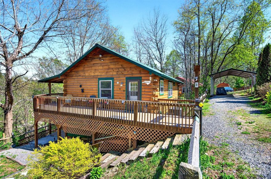 A lovely and rare find, this log cabin is an established short-term rental with two units (one bedroom, one bath each) and two kitchens. Enjoy the outdoors and peaceful country living, the stress floating away as you enjoy the beautiful view approach to this property. True Log cabin with vaulted ceilings. Low maintenance; has a newer metal roof. Great income producer—or simply enjoy it as your primary residence. The acre-plus corner lot has potential to subdivide (buyer to confirm). Two fenced yards are great for pets and play! Relax on the double wraparound decks and a fire pit area. Turnkey and move-in ready—or start booking Airbnb stays immediately. Located only 25 minutes to downtown Asheville and 15 minutes to West Asheville.