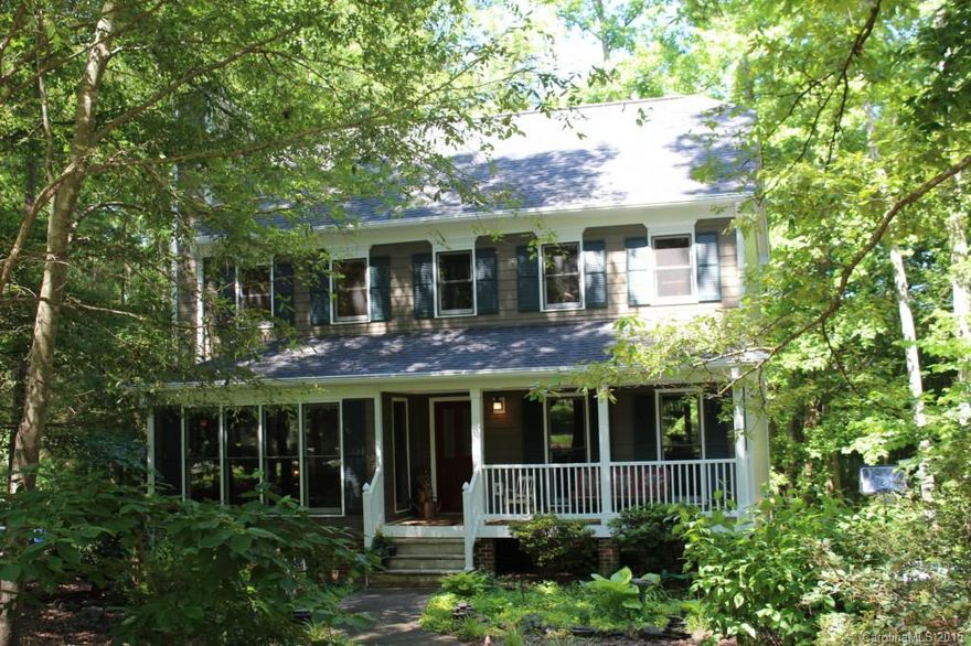 Charming traditional 2 story w/ rocking chair frnt prch situated on beautifully treed lot. Covered deck off kit area has lovely view of wooded back.  Updates include:  2008 dual HP; 2012: hardy board siding, garage doors, gutters, and frnt prch railings & columns.  Inter.: recently painted; mstr bth tile flr & gorgeous tiled shower; tile floor 1/2 bath; hwd flooring throughout 1st floor except for 1/2 bth.  Partially finished unheated attic area with fixed stairs w/ potential as bonus rm or ofc.