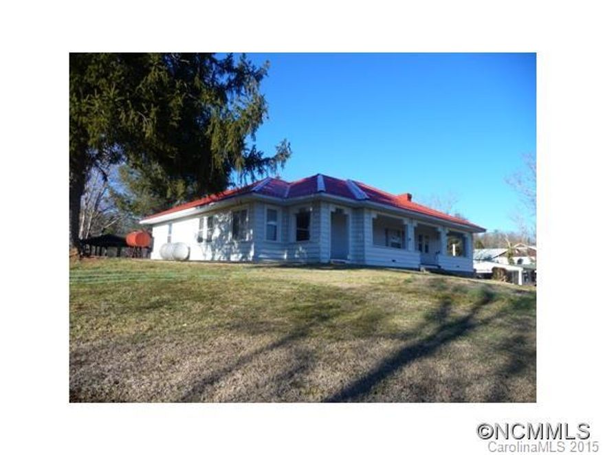 BEAUTIFUL WELL KEPT OLDER HOME OVERLOOKING DOWNTOWN MARSHALL AND THE FRENCH BORAD RIVER. GRAND LONG RANGE VIEWS TO ENJOY FROM THE COVERED FRONT PORCH AS YOU LISTEN TO THE MAJESTIC FRENCH BROAD RIVER. ONLY TWO MINUTES TO DOWNTOWN MARSHALL AND 2 MILES TO GROCERY AND GAS. ONLY 20 MIN. TO ASHEVILLE. NEW METAL ROOF. HARDWOOD UNDER CARPET PER SELLER.