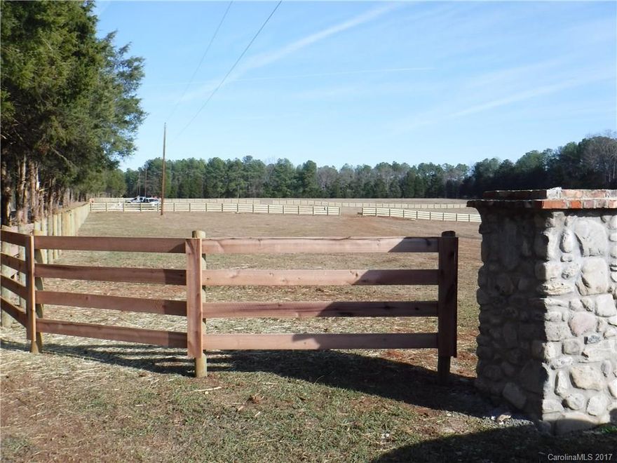 Beautiful setting ready for your dream home. See the individual entrances wired for light, 4 plank horse fencing. Any added fencing must match existing fences. Well and Septic required.