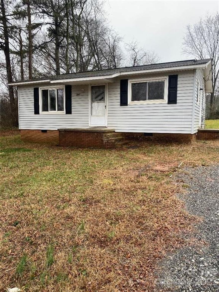 Neat two bedroom, one bath house blt in 1966; New flooring in living room, hall, and bathroom.  New carpet in bedrooms, freshly painted; washer/dryer connections.  Electric Range, fenced back yard (no gate but connector poles are there; Grass sewed in fall, nice yard; Has been rental.  Nice first time or investment rental, dead end street, very close to I-77 and shopping, schools, grocery stores.  City water & power, Heat pump for heat and air, septic system just had additional lines added.   Listing Firm does not hold earnest money.