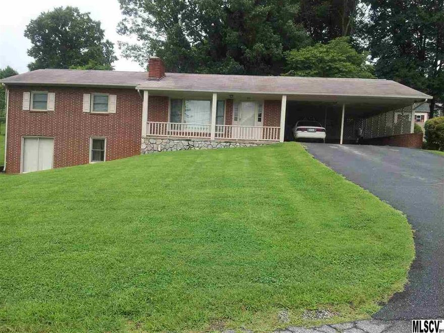 Beautiful brick home with full basement on a dead end street.  The living room has a fireplace with builtins as the focal point. The large kitchen and dining area have access to the back yard patio.Three bedrooms on main level, one had been used as a sitting room and has closet. The full basement is heated and cooled and has two finished rooms and a bath. The finished basement den has the second fireplace and a walkout door.  The unfinished area of the basement also has exterior access. The double attached carport is oversize.   The home had windows replaced in 1998; gutters replaced 2004.  The owner says the upstairs has hardwoods under the carpets.