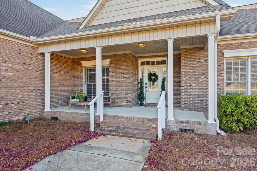 HUGE PRICE REDUCTION! This home in Clover combines space, practicality and luxury all in one wonderful location at an amazing price!  The large front porch welcomes you home, while the plantation shutters throughout and the  custom hardwood floors in the living area and dining room give you a luxurious feel.  The unique kitchen with Jenn-air range opens up to the breakfast nook all within view of built-in bookshelves that surround the gas fireplace.  If that is not enough, the French doors lead out to a bright sunporch and then onto a large deck with place for a swing and then an outdoor fire pit and living area.  There are even pecan trees and a fig tree in the yard!  The primary bedroom has tray ceilings, dual walk-in closets, a jetted tub, a walk-in shower and two sinks for convenience.  With the split plan, the other two bedrooms share a full bathroom and the bonus room upstairs offers a flexible space for anything you need.  Outside on the acre lot, you will find access to the well with a hand pump that can be attached and used, a charming fenced in area for a private garden, crepe myrtle trees and then there is an extra water storage tank in the crawl space. The two -car side load garage rounds out the property on a flat lot. You don't want to miss this special home near Clover schools and all that this convenient location has to offer!